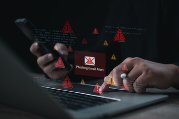 A digital phishing email alert displayed on a laptop as a user checks a smartphone, highlighting cybersecurity risks, online threats, and the importance of protecting sensitive information in modern t