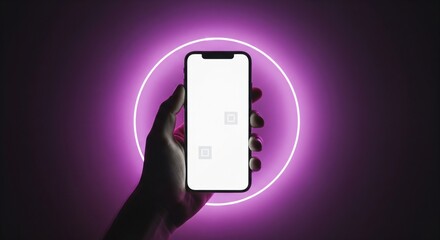 Hand holding smartphone with blank screen against purple neon circle