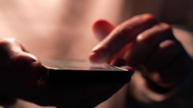 A person scrolling through a news feed on a touchscreen mobile phone.
Using social media on a phone.
Entering a PIN code on a touchscreen smartphone.