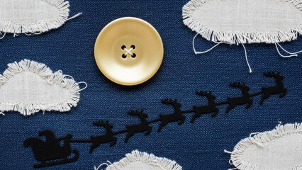 Christmas craft with santa sleigh reindeer clouds and button on blue fabric