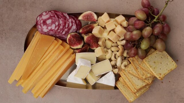 cheese platter with grapes and nuts concrete zoom top view food