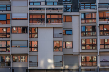 View of modern building with balconies in city center during day