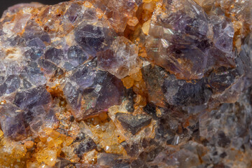 Quartz and fluorite crystal formation with bright reflections on geological rock