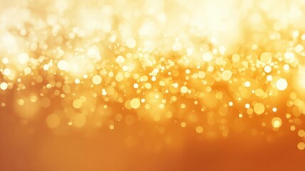 Abstract warm golden bokeh lights shimmering and glowing with a soft focus effect creating a festive and magical atmosphere