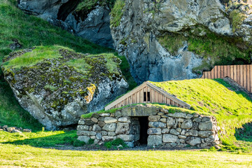 A stone shelter nestles into the hillside under Southern Iceland&rsquo;s afternoon sky where tradition and nature quietly converge