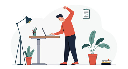 Man working on laptop at standing desk