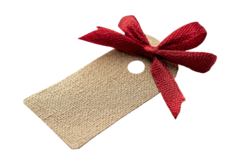 Tan burlap tag with a red ribbon bow isolated on white background in high quality transparency for microstock