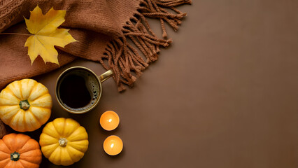 Cozy Autumn Flat Lay with Pumpkins, Coffee, Candles and Blanket on Brown Background