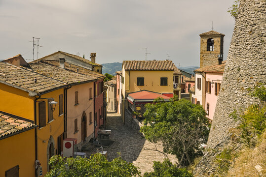 Imposing circular tower and curtain wall of the historic Rocca di Montebello in Emilia-Romagna.