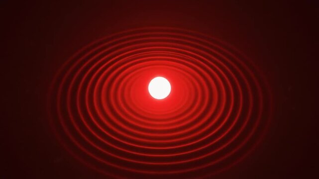 Abstract red laser diffraction pattern with glowing concentric circles of light on a dark background, illustrating wave optics and physics
