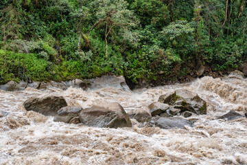 Scenic dramatic view with the powerful waters of Urubamba River crossing the Sacred Valley in Aguas Calientes