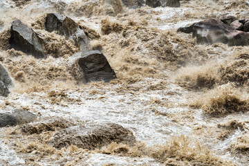 Scenic dramatic view with the powerful waters of Urubamba River crossing the Sacred Valley in Aguas Calientes