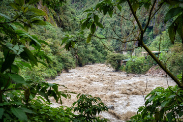 Scenic dramatic view with the powerful waters of Urubamba River crossing the Sacred Valley in Aguas Calientes