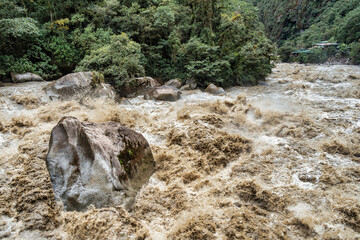 Scenic dramatic view with the powerful waters of Urubamba River crossing the Sacred Valley in Aguas Calientes