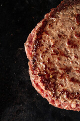 raw meat and on a grill