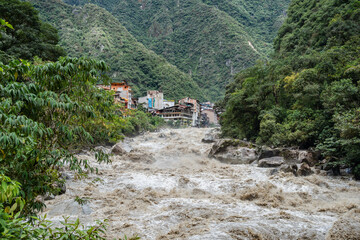 Scenic dramatic view with the powerful waters of Urubamba River crossing the Sacred Valley in Aguas Calientes