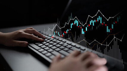 A close-up view of hands on a keyboard engaged in analyzing stock market trends, with dynamic financial graphs displayed on a screen, highlighting trading and investment strategies. Scalp