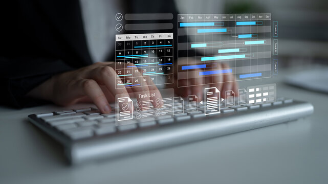 A person types on a keyboard in a modern office while engaging with a digital task management interface. The image highlights productivity and innovative technology in workspace. Gantry