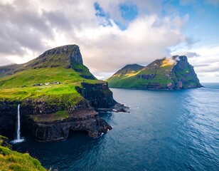Dramatic cliffside waterfall plunges into a deep blue ocean under a cloudy sky, surrounded by lush green hills