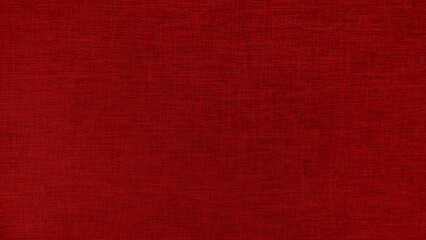 Red linen fabric texture background. High resolution close up of natural woven textile surface. Red canvas material pattern for abstract wallpaper or furniture upholstery design.