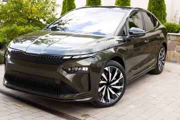 Modern subcompact electric crossover car SUV. Exterior details. Large size wheels. Exterior of...