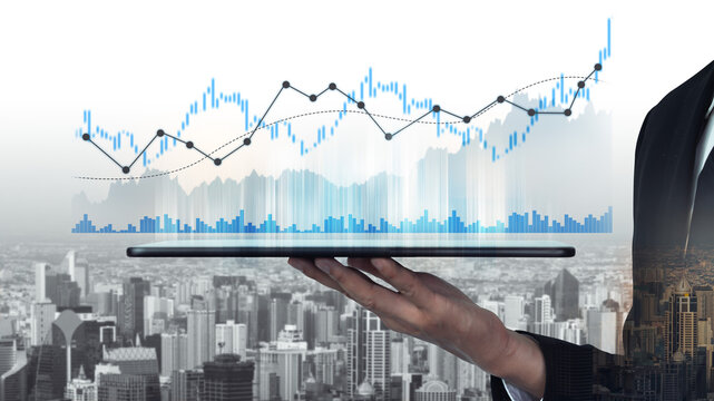 A businessman skillfully holds a tablet displaying financial graphs and charts against a city skyline, representing growth and investment opportunities in the financial sector. Scalp