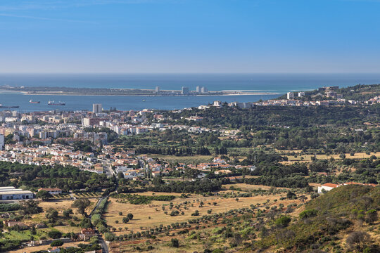Stunning panoramic view of Setubal, Portugal, overlooking the Sado Estuary and the scenic Tr&oacute;ia Peninsula. A beautiful coastal cityscape.