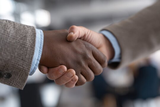 Successful office handshake between two professionals in a modern workspace emphasizes collaboration and mutual agreement for future partnership opportunities