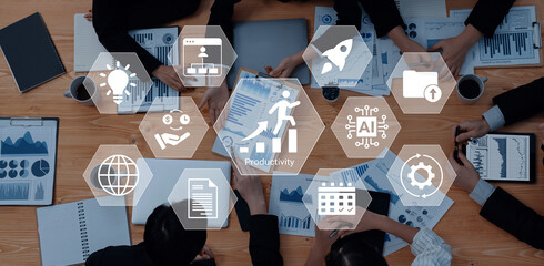 A diverse team is engaged in collaborative project planning, analyzing data charts, and discussing innovative productivity solutions in a modern office environment. Gantry