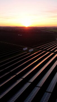 Aerial view of solar panels at sunset, United Kingdom.