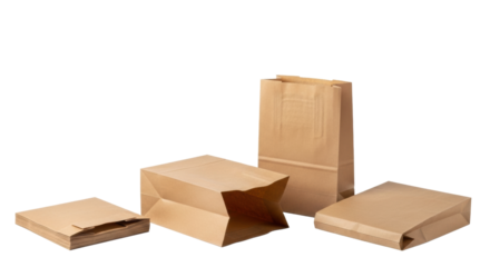 four identical unbranded brown kraft paper bags, variously arranged on a transparent background with soft studio lighting, promoting sustainable packaging solutions