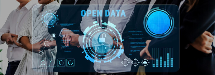 A group of business professionals discusses the importance of open data and security, surrounded by a futuristic digital interface showcasing analytics and information. Trope