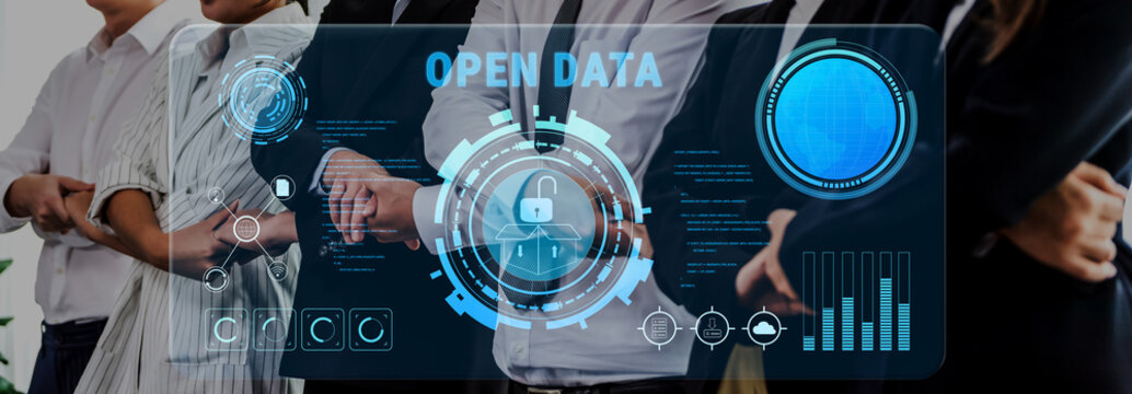 A group of business professionals discusses the importance of open data and security, surrounded by a futuristic digital interface showcasing analytics and information. Trope - Powered by Adobe