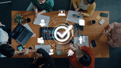 A diverse team collaborates in a modern office setting, engaging in strategic discussions and data...