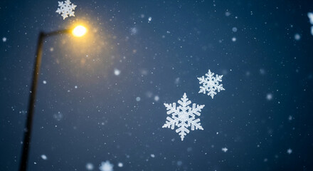 Naklejka premium Image of falling snowflake against a dark blue sky with street light, representing winter season, holiday celebration, and the tranquility of nature
