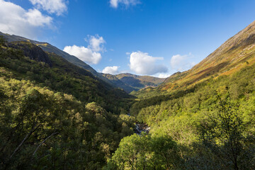 Fototapeta premium Panoramic view of the stunning, historically rich Glen Nevis near Fort William in the Scottish Highlands, nestled beside Ben Nevis, the UK's highest mountain. 