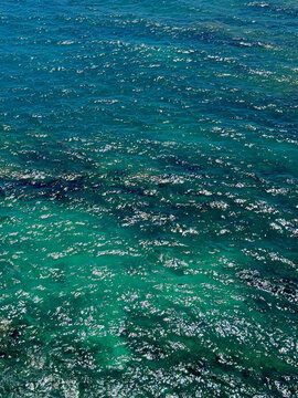 Glittering ocean blue turquoise water surface.
