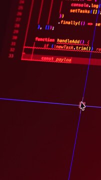 Real-time generated typing computer source code in closeup shot on monitor - white letters running on red background - concept of digitization, science, research and course of a program script