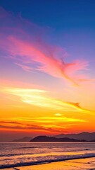 Vibrant sunset over ocean, colorful sky reflecting on water