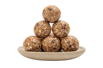 Stack of energy balls on a plate isolated on white background