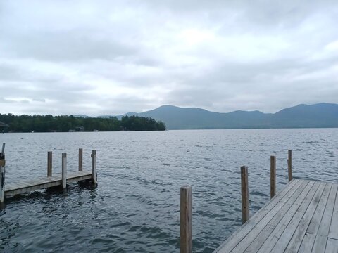 A dockside view of Lake George on a cloudy day in the Spring. - Powered by Adobe