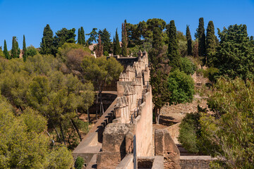 Malaga, Spain - August 06, 2024: Walls and bastion of the castle fort Gibralfaro in Malaga. Castillo de Gibralfaro.