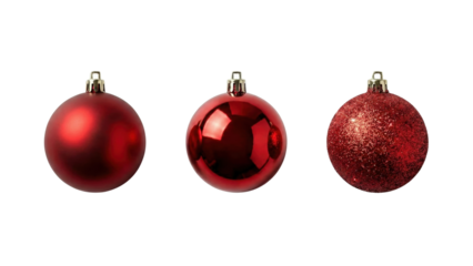 Festive Trio: Three classic ornaments, each reflecting the spirit of the season with their varied textures and radiant red hues, symbolising joy and anticipation.