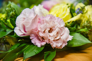 A colorful flower arrangement, a wreath or decoration made of a combination of dry and artificial flowers.