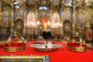  Two crowns, a cup of wine and a cross prepared for baptism