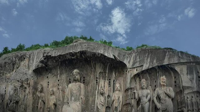 view of the famous Vairocana Buddha statue that lies in the Luoyang Longmen Grottoes complex in China. The statues dates from the 7th century.