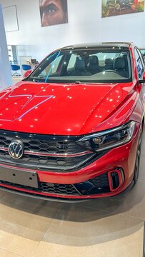 Brazil, May 2, 2025.Vibrant Red Volkswagen Sedan Jetta GLI on Display in a Modern Showroom