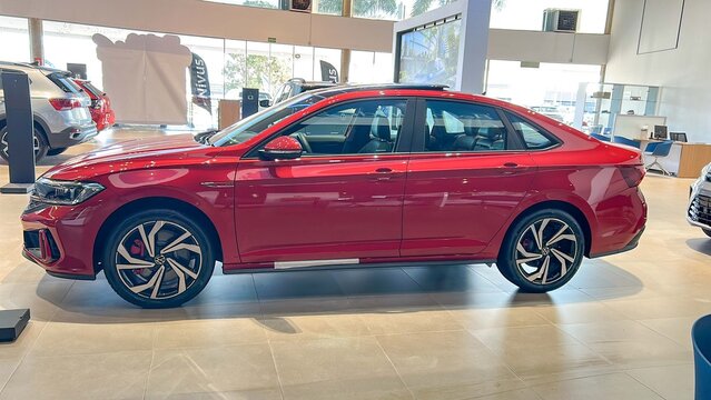 Brazil, May 2, 2025.Vibrant Red Volkswagen Sedan Jetta GLI on Display in a Modern Showroom