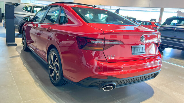 Brazil, May 2, 2025.Vibrant Red Volkswagen Sedan Jetta GLI on Display in a Modern Showroom