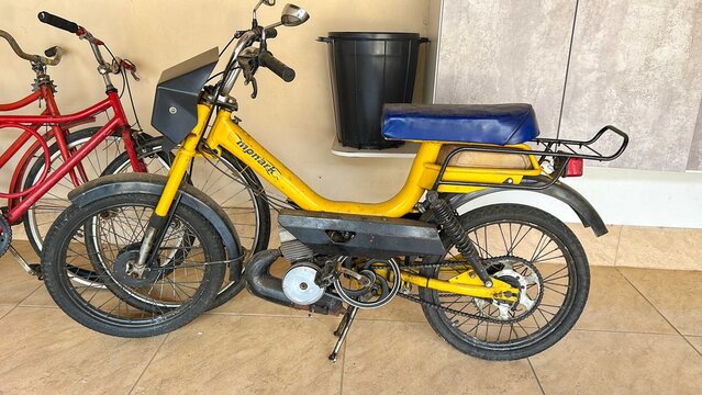 Brazil, April 18, 2025. Vintage Monark moped, 1982 model, yellow. Original Sachs 49cc engine. Monaretta